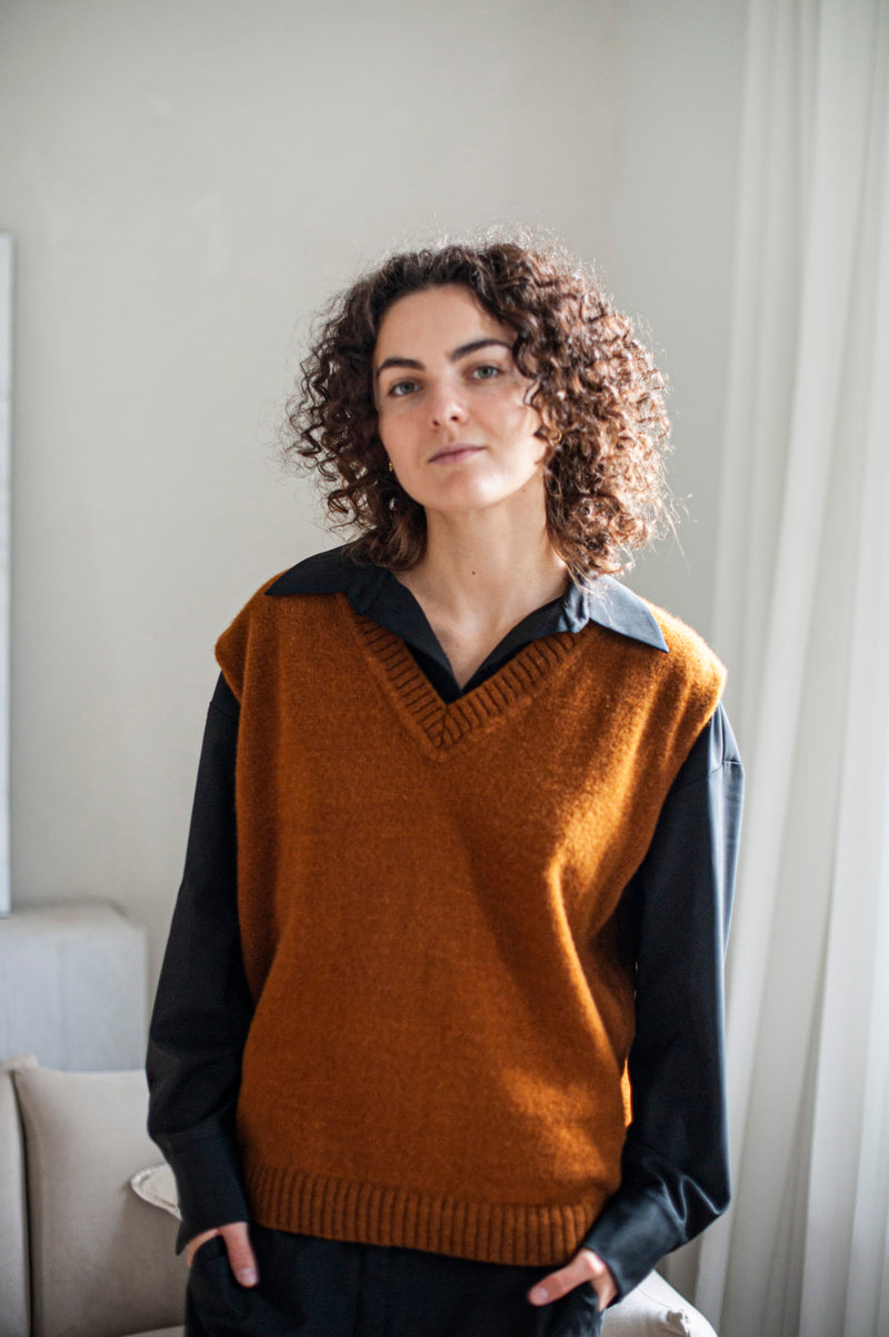 Knitted Merino wool sweater vest in an oversized silhouette featuring a ribbed hem.
