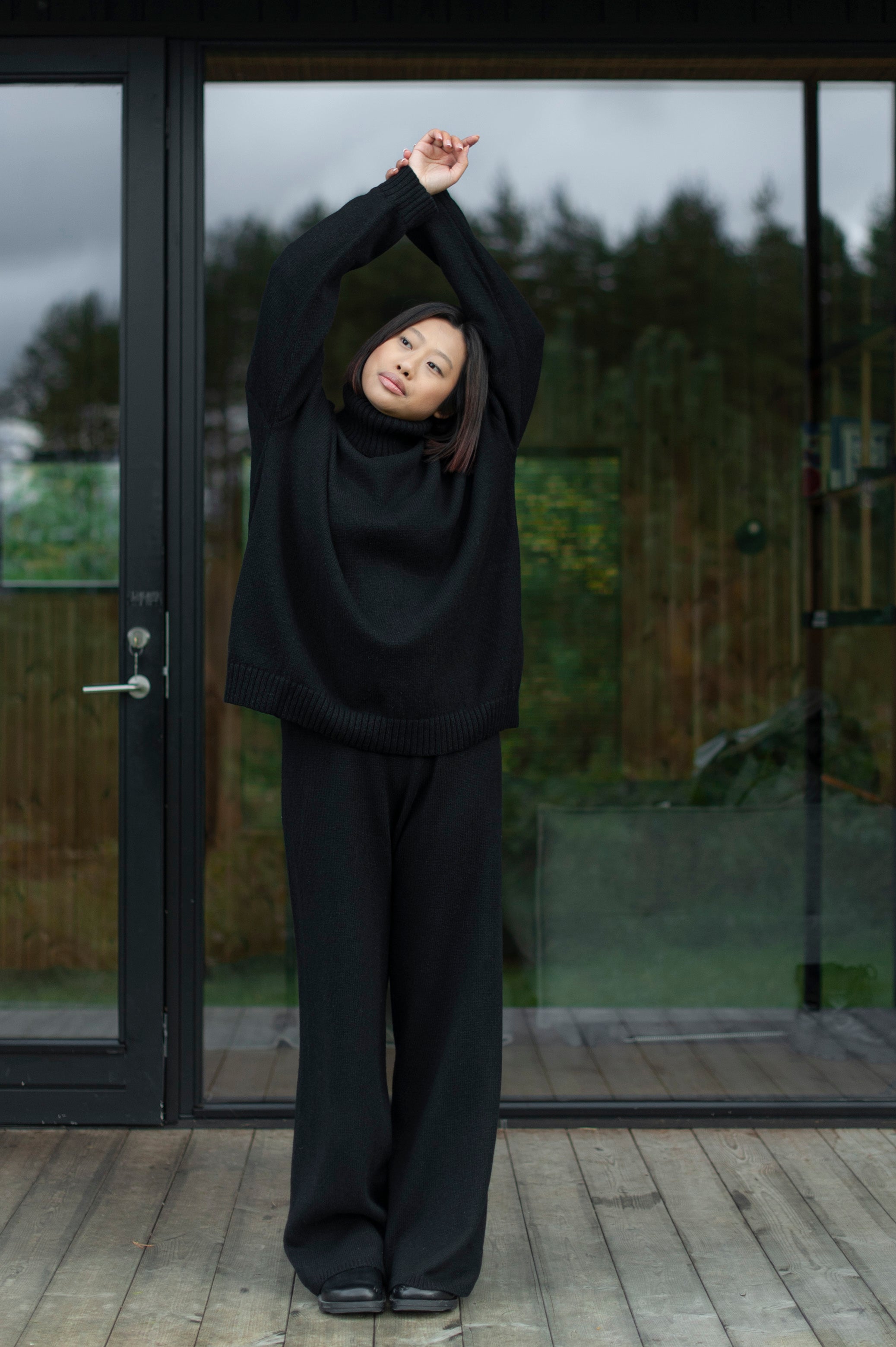 Color coordinate knitwear set of an oversized knit sweater and knit pants. 