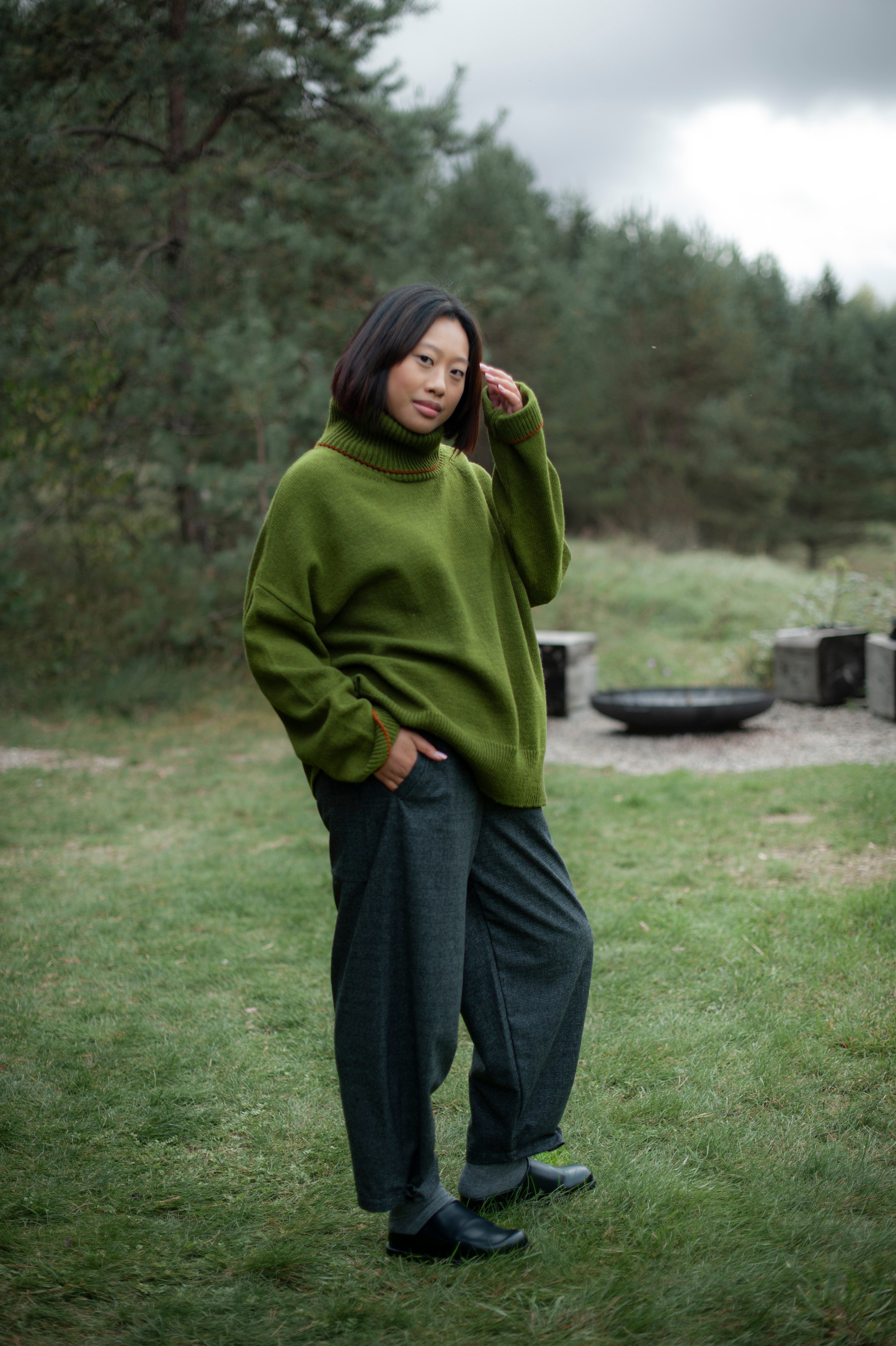 Knit green merino wool jumper and dark brown pants
