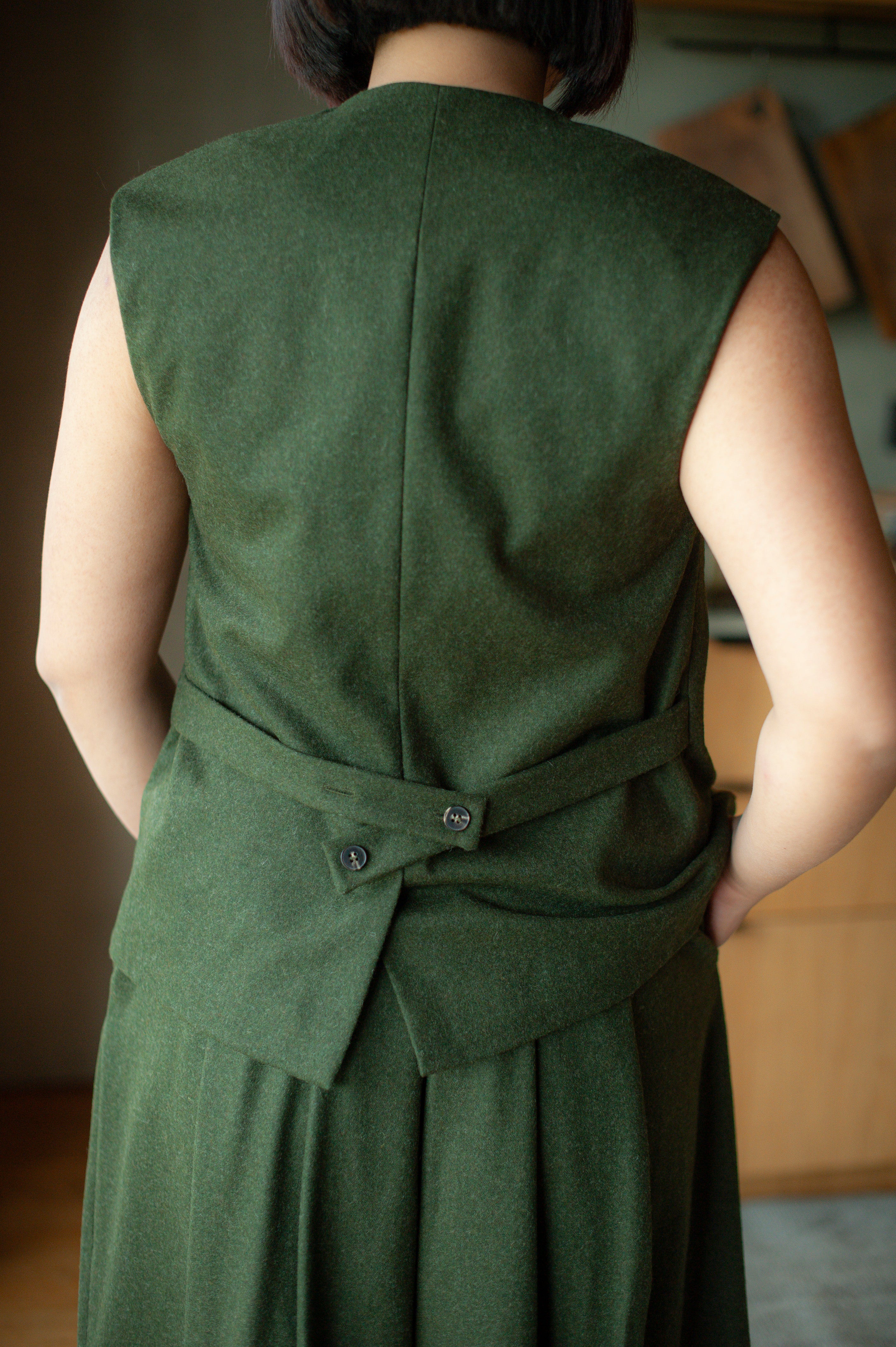 Cinched back of the wool vest