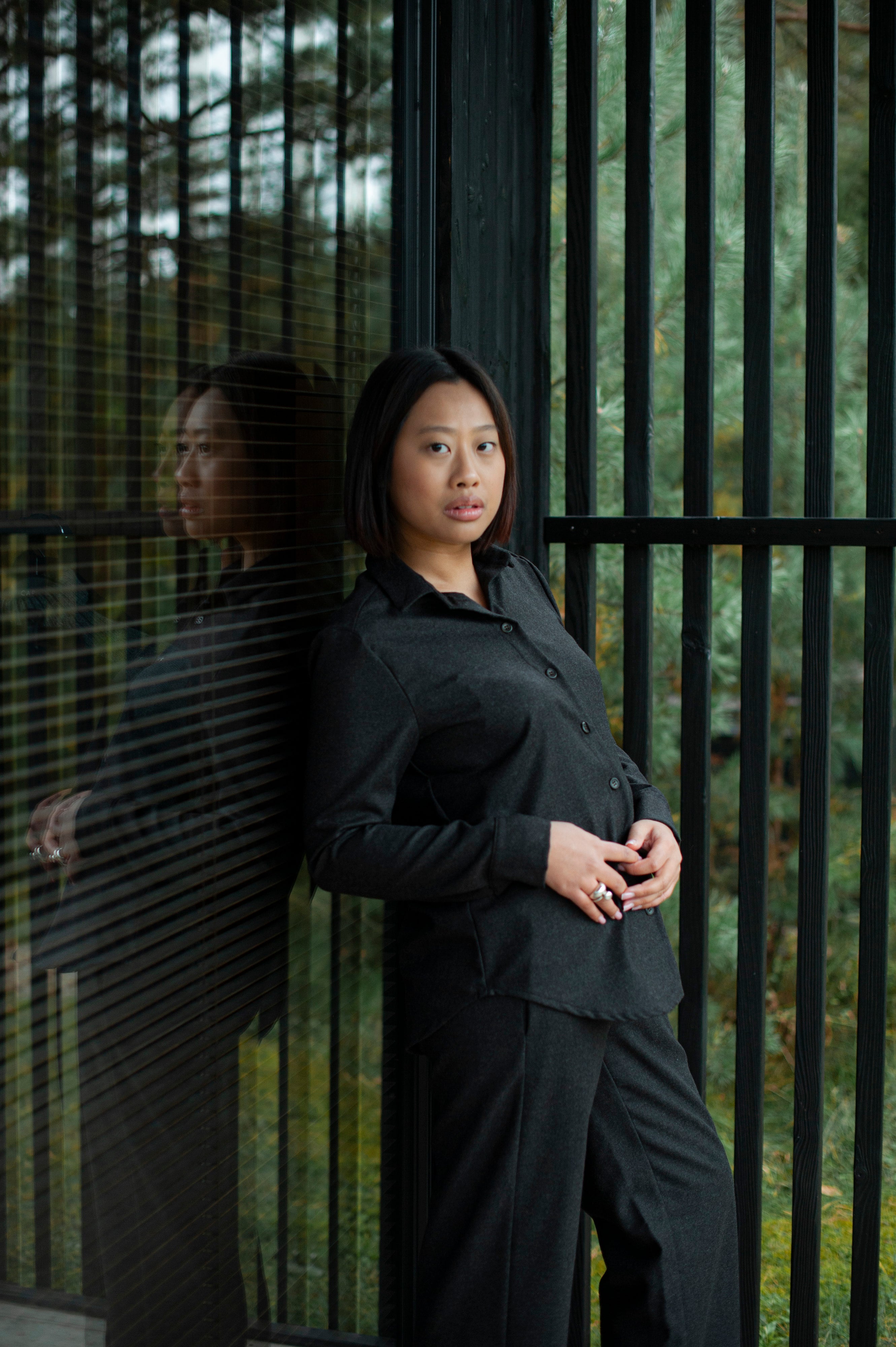 Women’s brown wool Oxford shirt with a relaxed straight fit and regular collar, paired with matching brown straight-leg pants for a minimalist, elegant look.