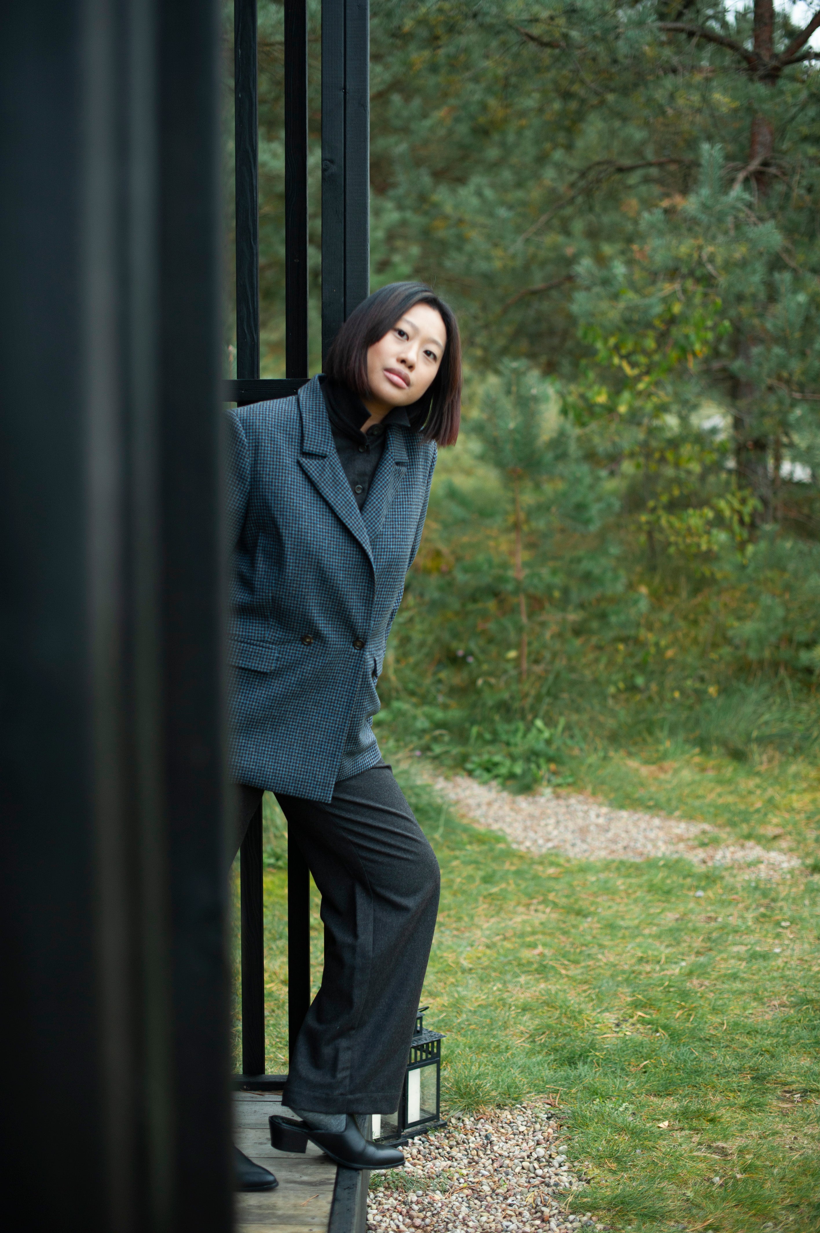 Minimalist straight double-breasted blazer in blue checks, paired with dark brown pants