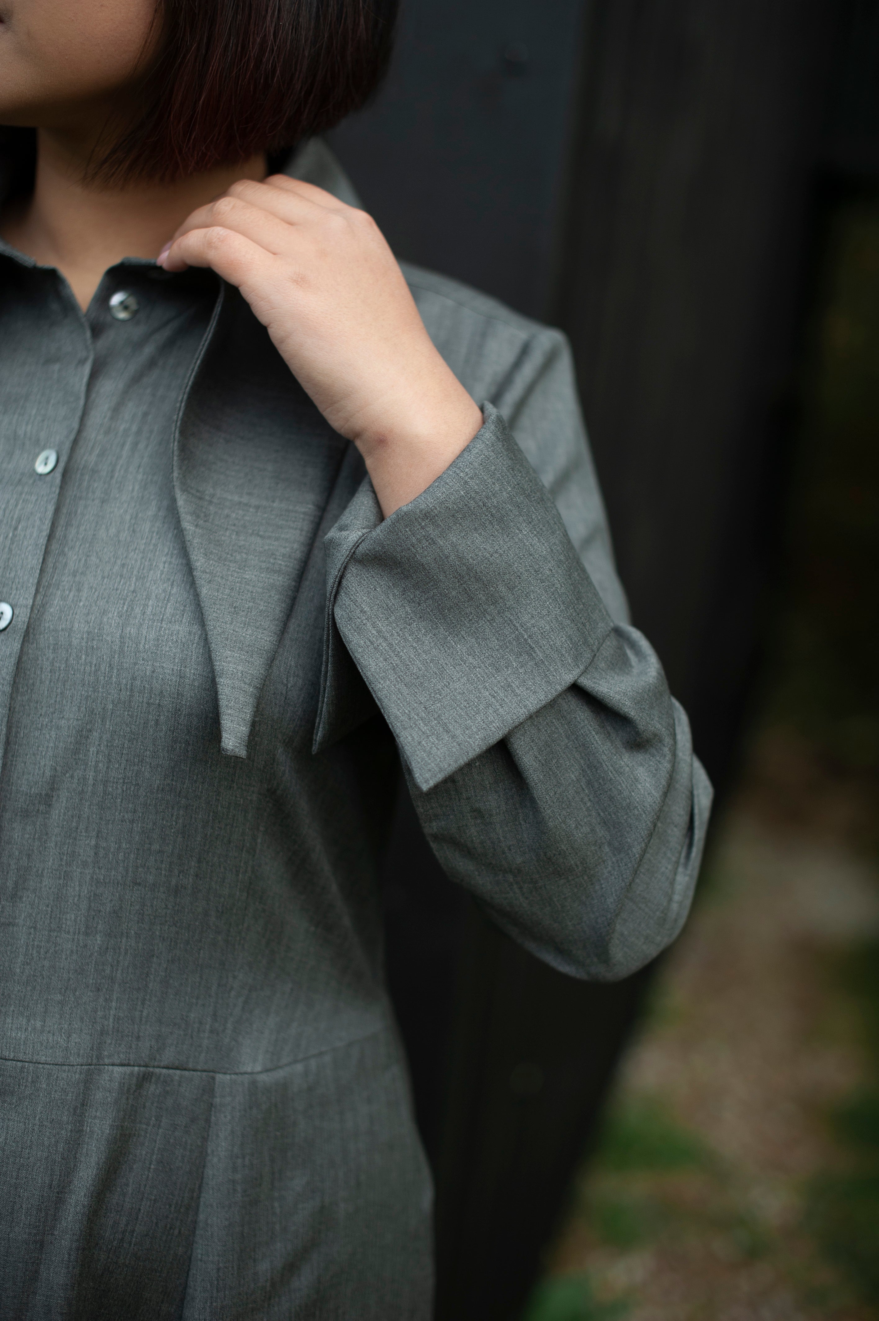 The French cuffs of an elegant merino wool dress